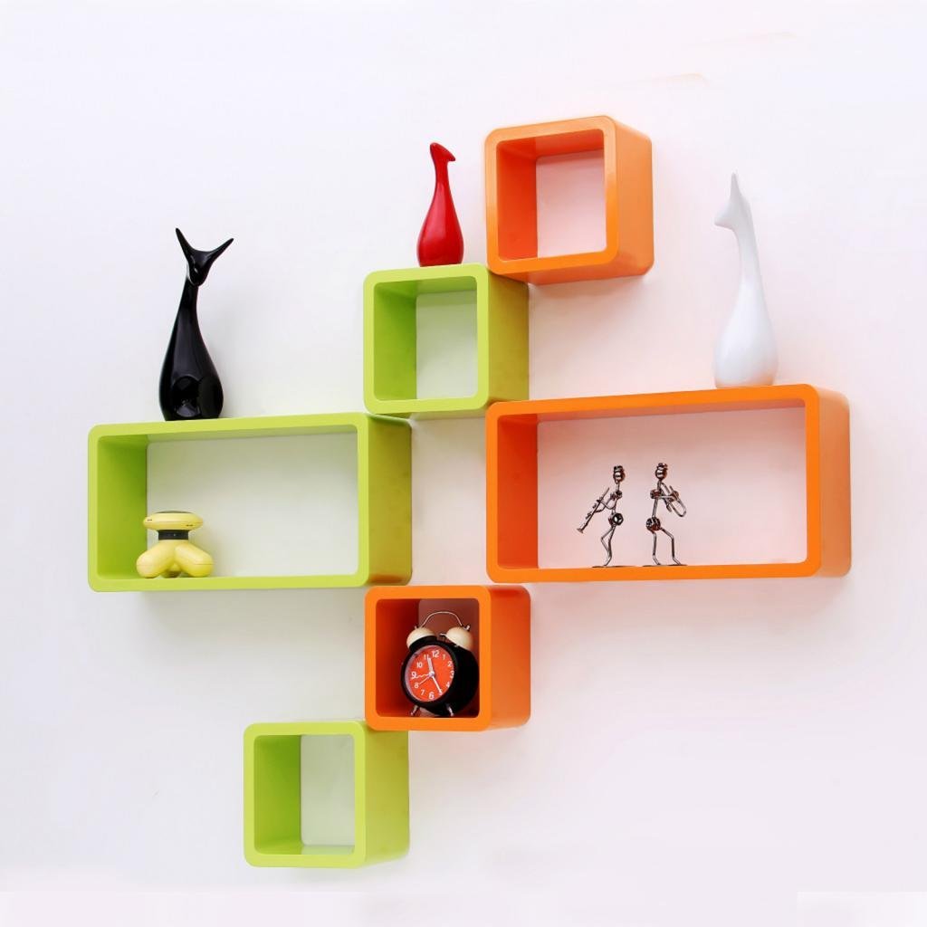 A modern 6-piece wall shelf set featuring cube and rectangle designs in vibrant green and orange, perfect for displaying books and ornaments.