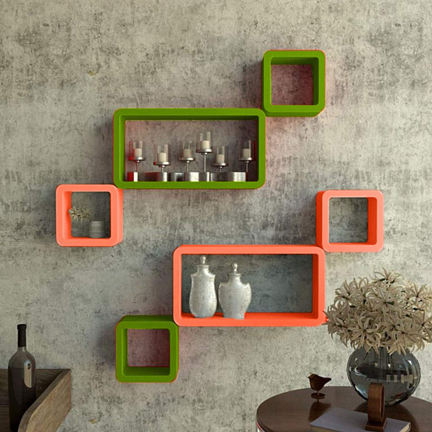 A modern 6-piece wall shelf set featuring cube and rectangle designs in vibrant green and orange, perfect for displaying books and ornaments.