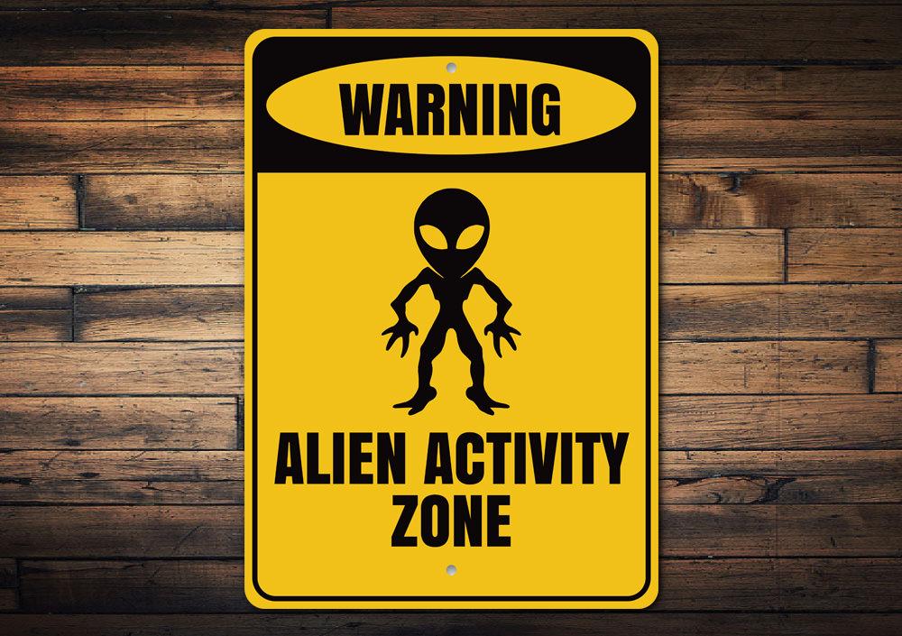 Warning Alien Activity Zone Sign made of durable aluminum, featuring vibrant colors and a playful design, perfect for kids' rooms.