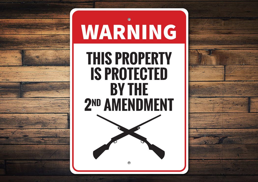 Warning Property Protected by 2nd Amendment Sign made of durable aluminum, featuring customizable text and pre-drilled holes for easy mounting.