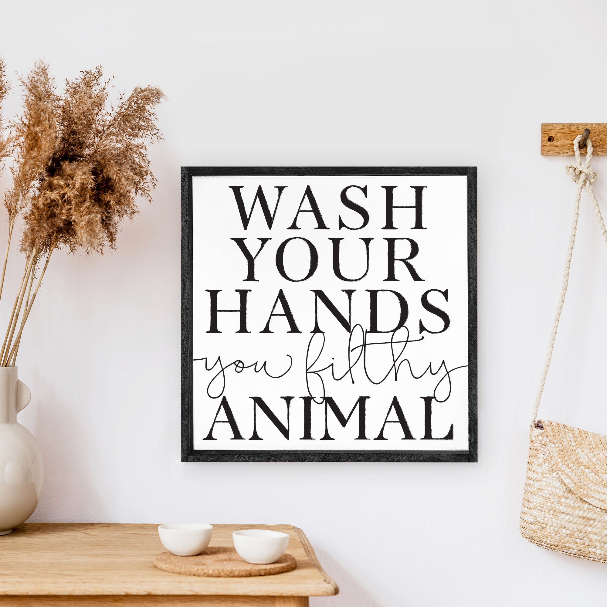 A humorous wooden sign that reads 'Wash Your Hands You Filthy Animal', featuring a rustic stained pine frame and waterproof design.