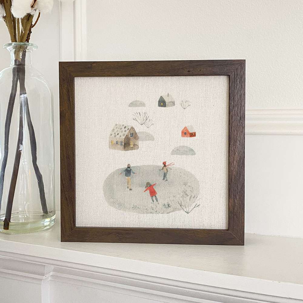 A beautifully framed sign featuring watercolor ice skating design, set in a stylish wood frame, available in walnut or white-washed finish.