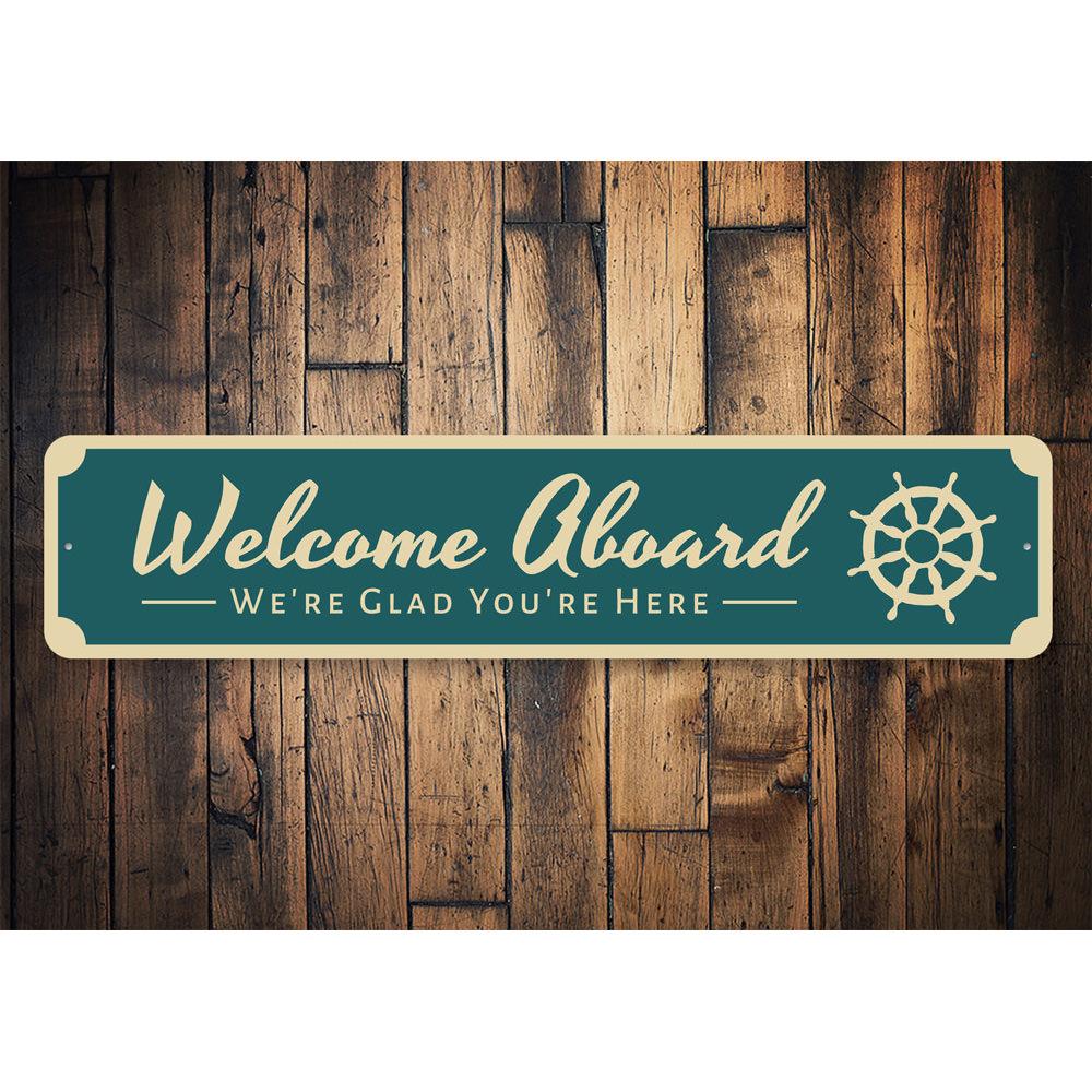 A decorative Welcome Aboard Sign made of high-quality aluminum, featuring a beach-themed design, perfect for coastal decor.