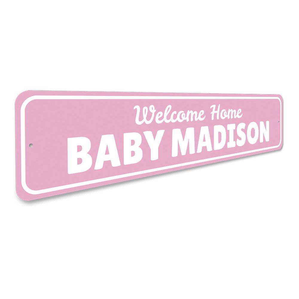 A decorative Welcome Home Baby Sign made of high-quality aluminum, featuring customizable text and pre-drilled holes for easy mounting.