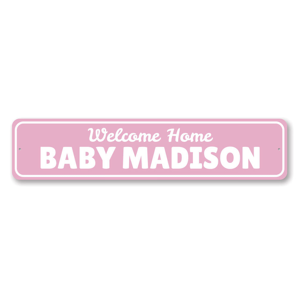 A decorative Welcome Home Baby Sign made of high-quality aluminum, featuring customizable text and pre-drilled holes for easy mounting.