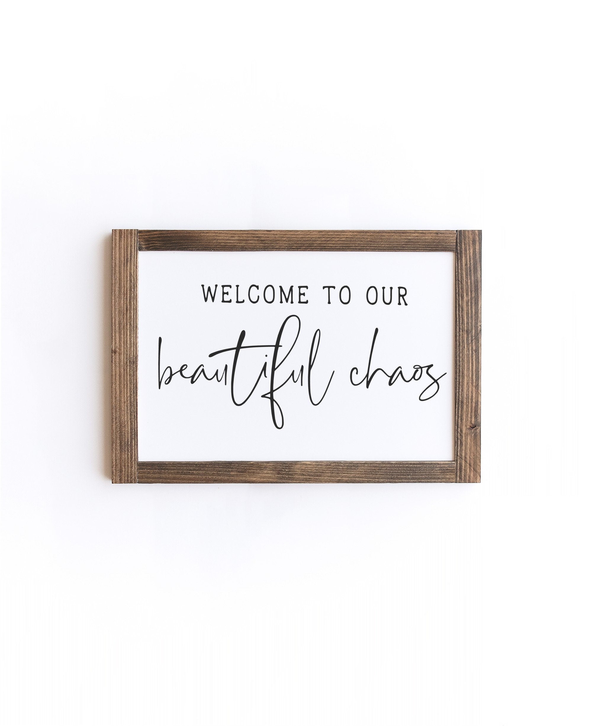 Beautiful Chaos Wood Sign with matte white background and painted lettering, showcasing unique wood grain and knots.