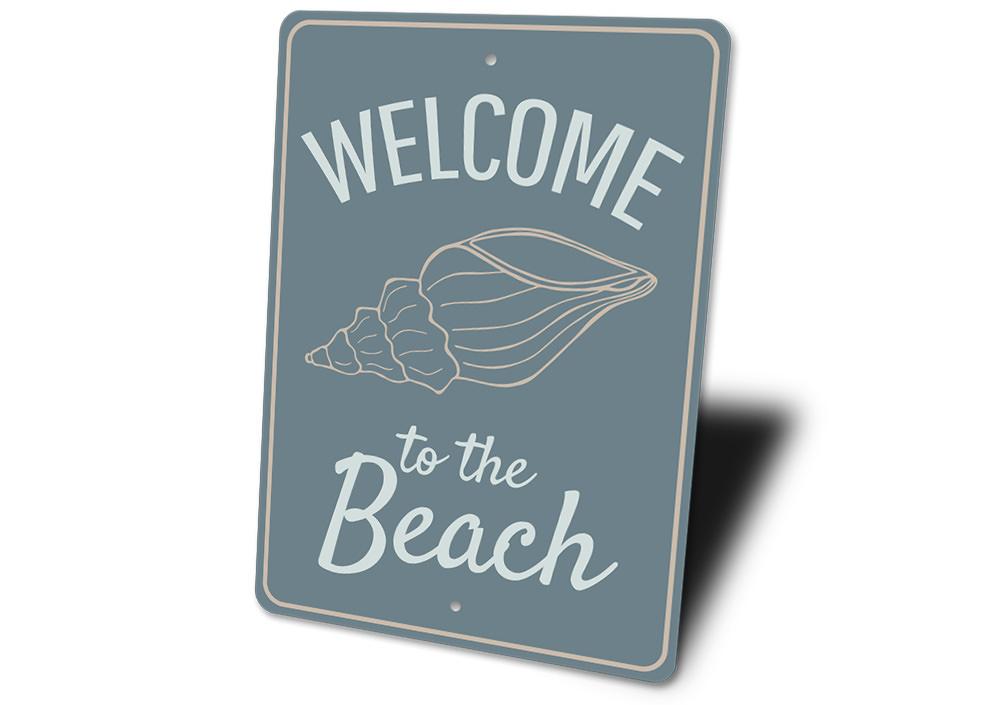 A decorative Welcome to the Beach Sign made of high-quality aluminum, featuring vibrant colors and a coastal design, perfect for beach houses.