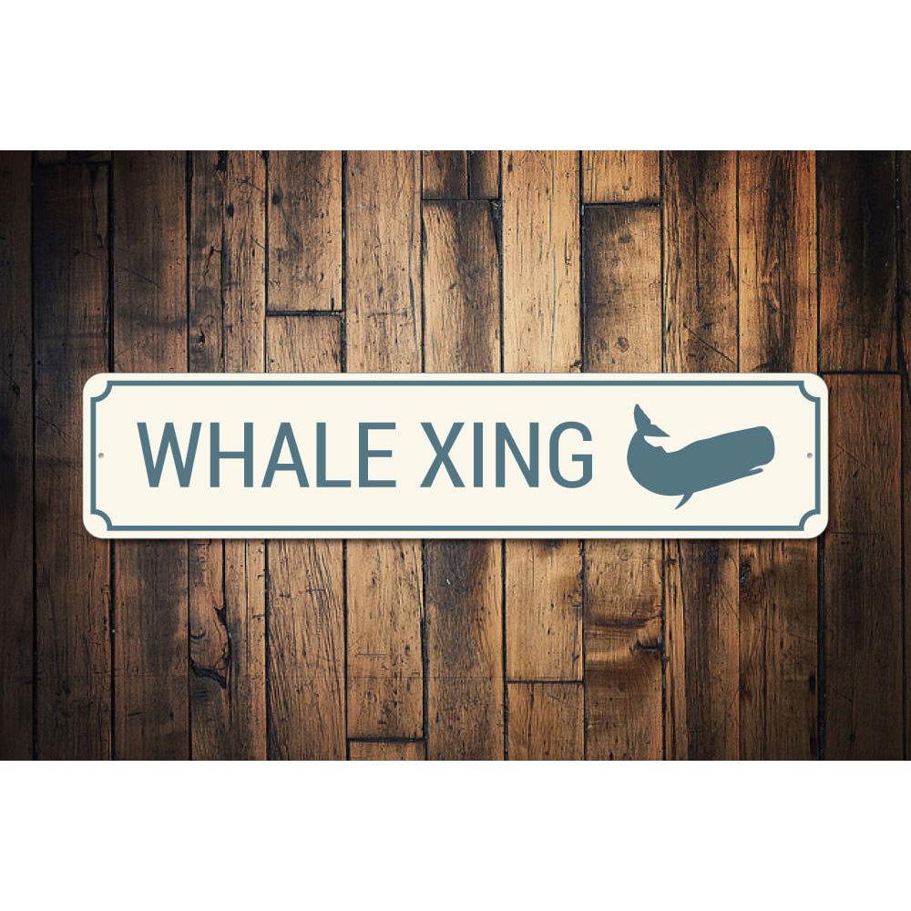 A decorative Whale Crossing Sign made of aluminum, featuring a vibrant design suitable for coastal decor.