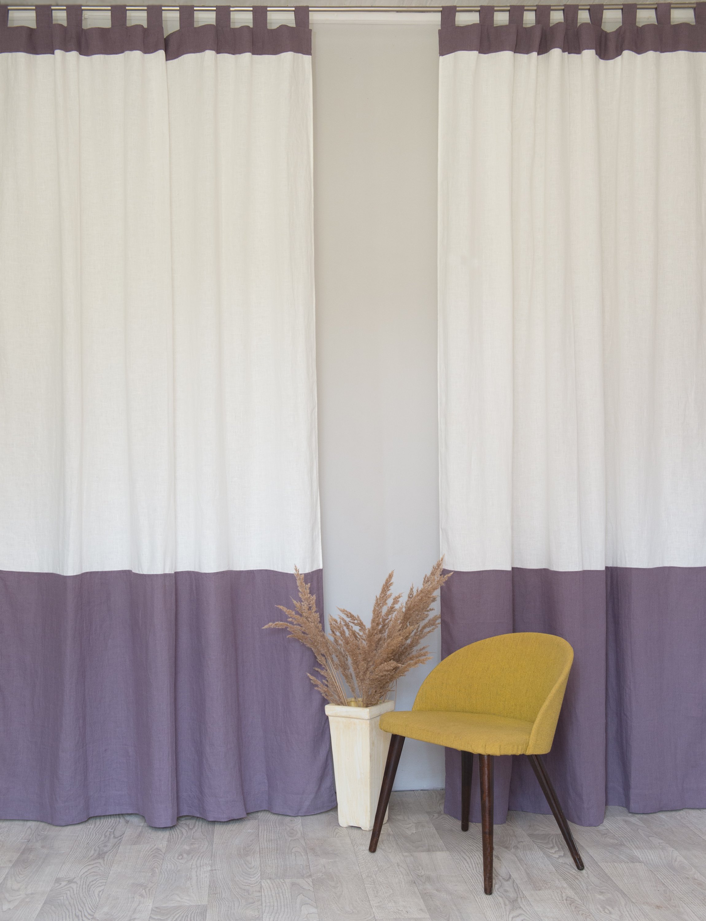 Elegant White and Pastel Plum linen curtains with tab tops, showcasing a modern two-tone design.