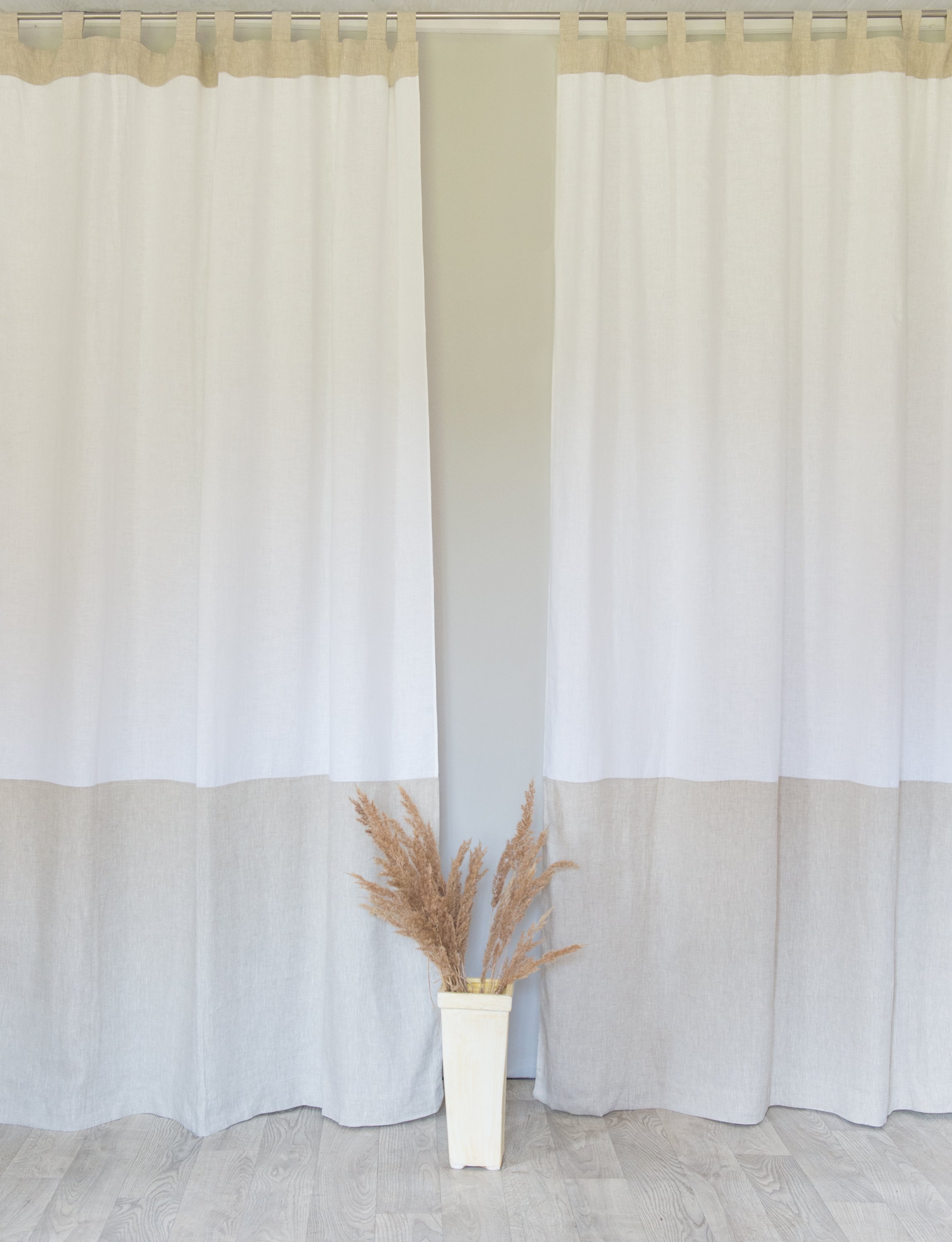 Elegant White and Pastel Plum linen curtains with tab tops, showcasing a modern two-tone design.