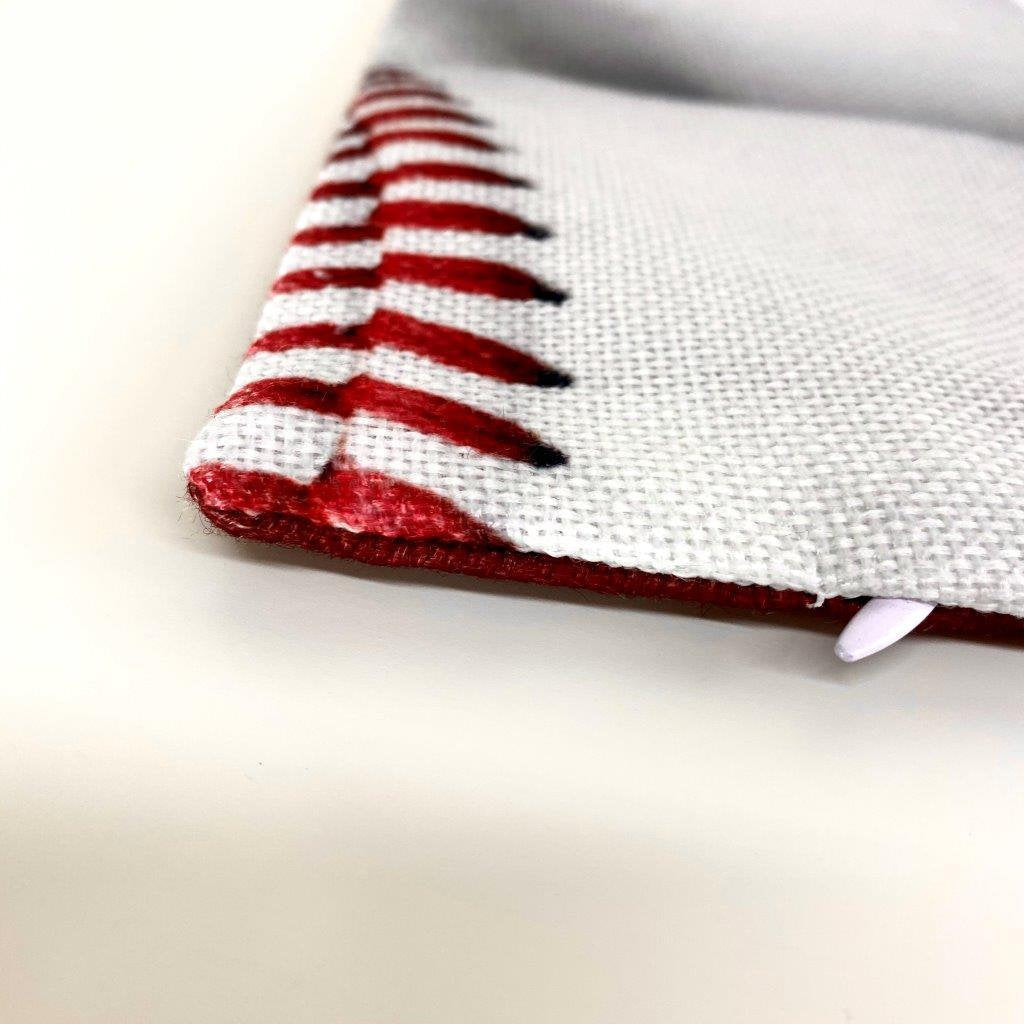 A collection of White Baseballs pillow covers featuring vibrant baseball graphics on the front and a solid red back, showcasing quality craftsmanship.