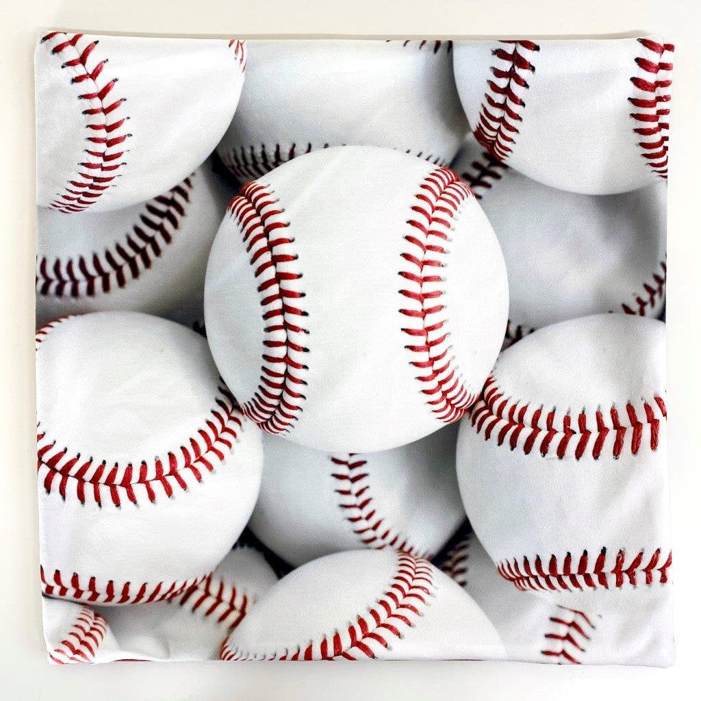 A collection of White Baseballs pillow covers featuring vibrant baseball graphics on the front and a solid red back, showcasing quality craftsmanship.