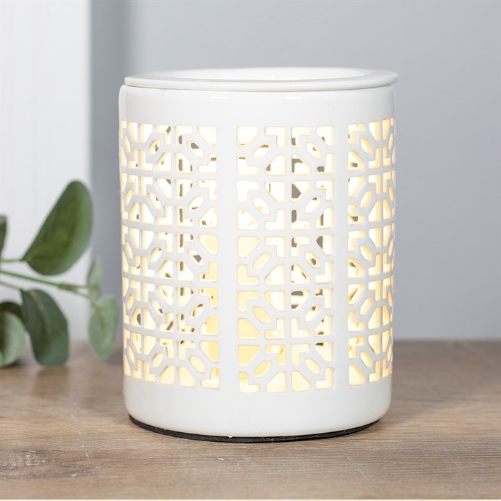 Elegant white ceramic electric oil and wax burner with imperial trellis pattern, showcasing its stylish design and functionality.