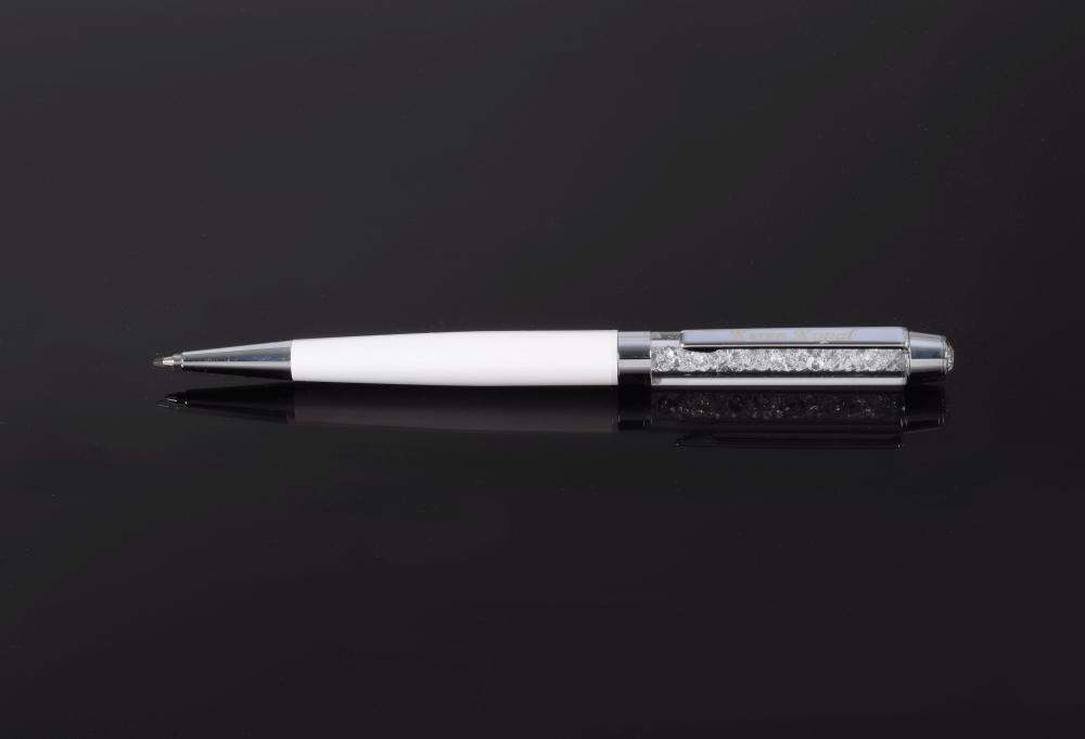 Elegant white pen adorned with sparkling Swarovski crystals, showcasing exquisite craftsmanship by Keren Kopal.