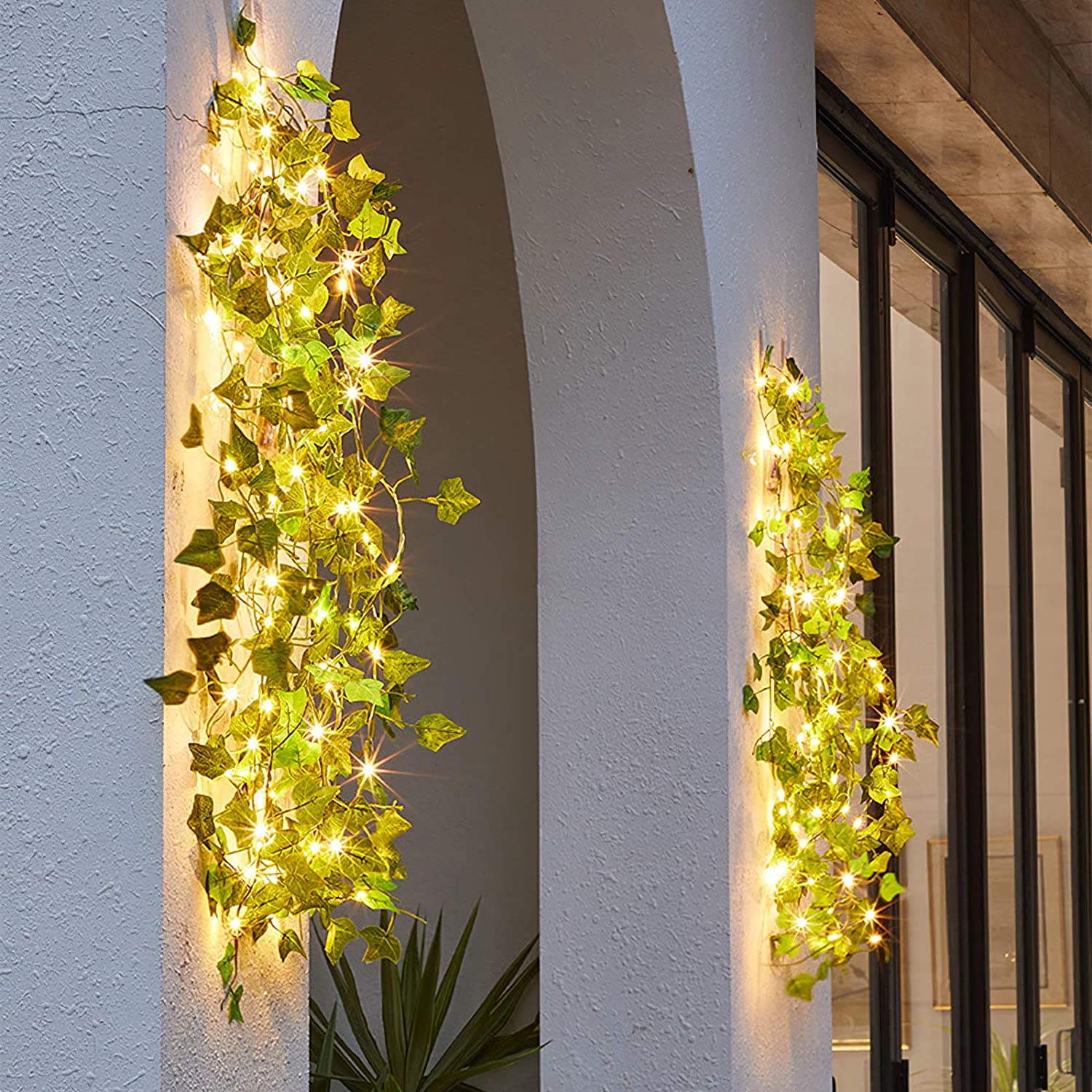A beautiful display of solar-powered maple leaves garland LED string lights, showcasing warm white lights intertwined with vibrant maple leaf decorations.