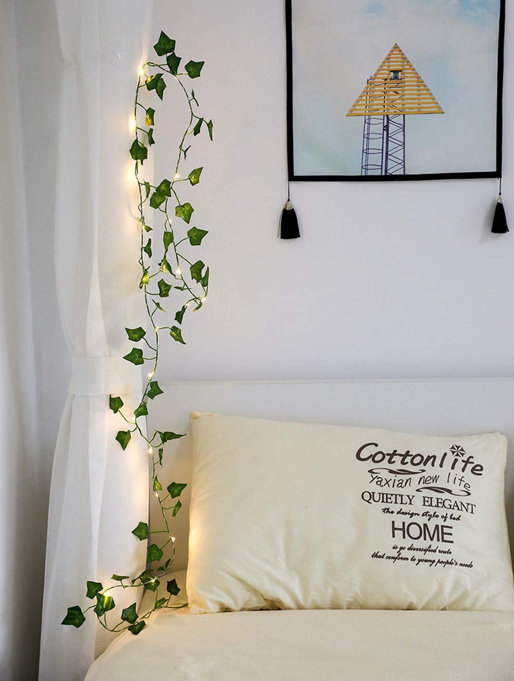 A beautiful display of solar-powered maple leaves garland LED string lights, showcasing warm white lights intertwined with vibrant maple leaf decorations.