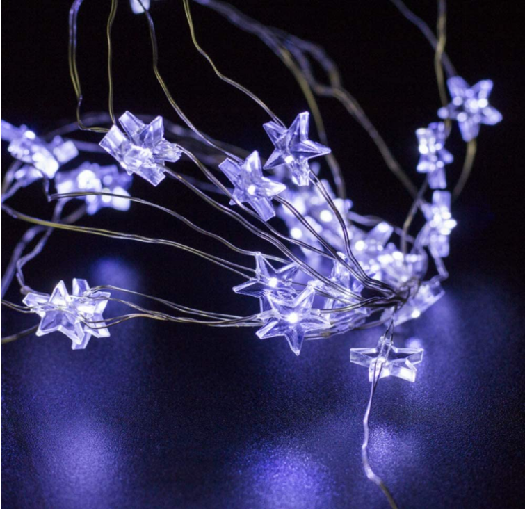 A string of 30 LED star-shaped fairy lights glowing brightly, showcasing their silver wire and waterproof design, perfect for indoor and outdoor decoration.