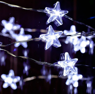 A string of 30 LED star-shaped fairy lights glowing brightly, showcasing their silver wire and waterproof design, perfect for indoor and outdoor decoration.