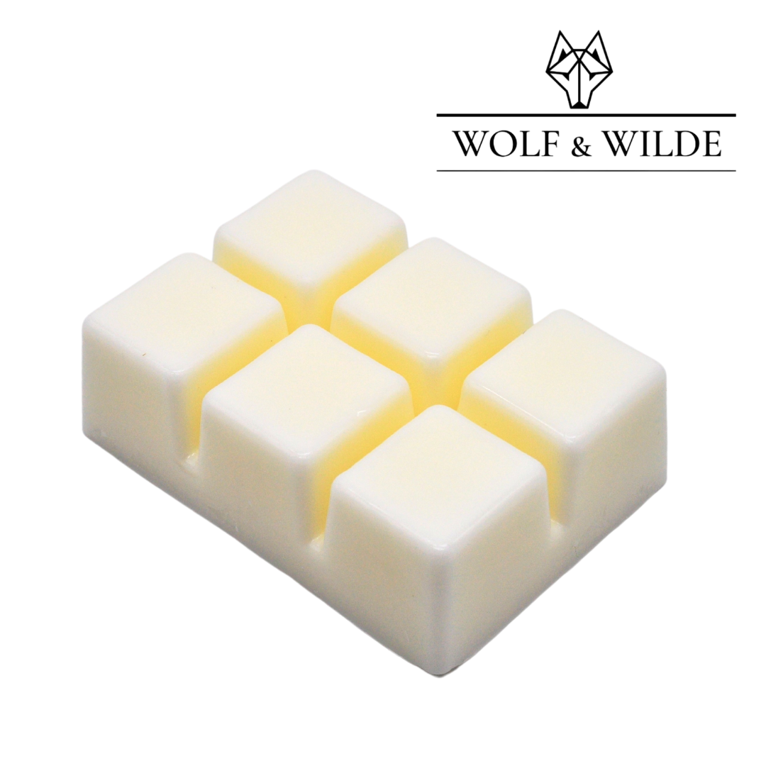 Wilde Enchantment Soy Wax Melts in a decorative package, showcasing a blend of floral and earthy scents.