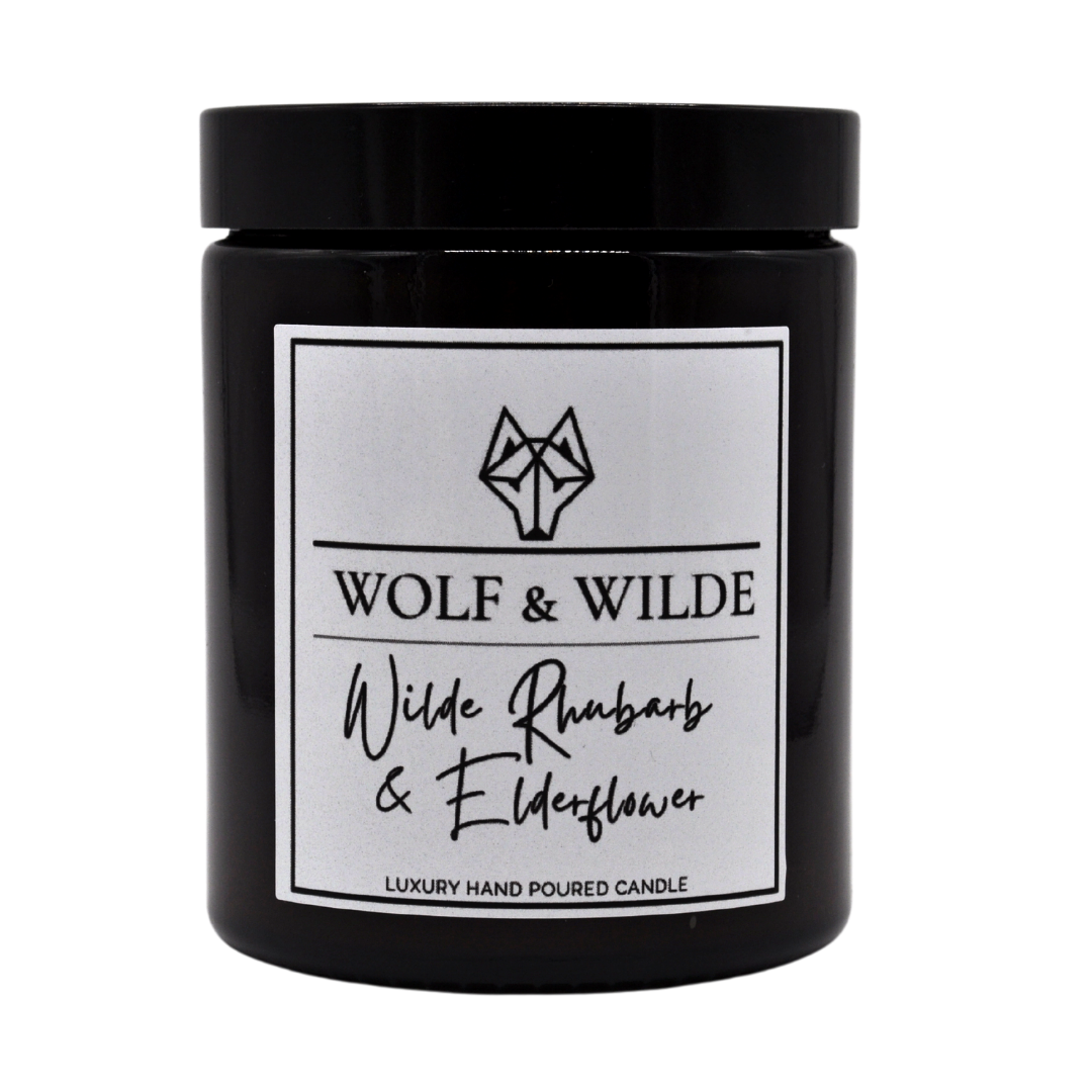 Wilde Rhubarb & Elderflower Luxury Handmade Scented Candle in an elegant glass jar with a warm glow.
