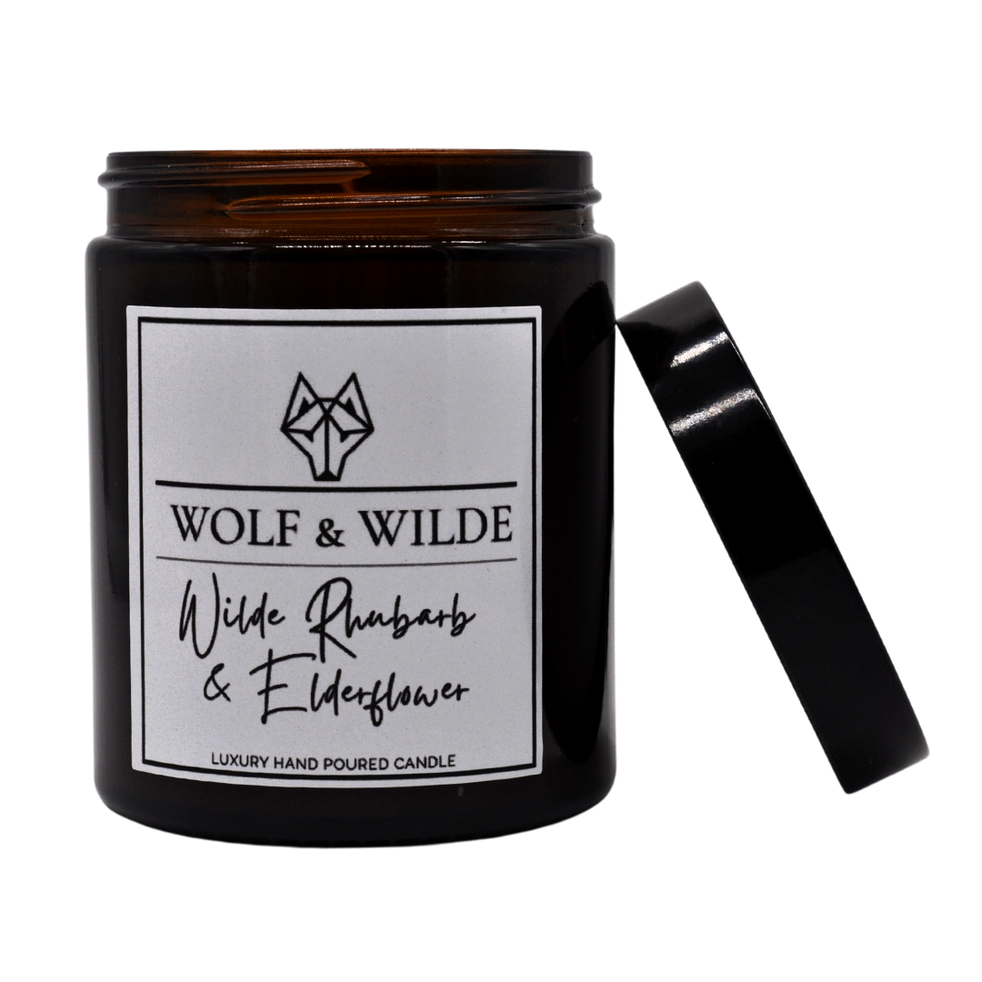 Wilde Rhubarb & Elderflower Luxury Handmade Scented Candle in an elegant glass jar with a warm glow.