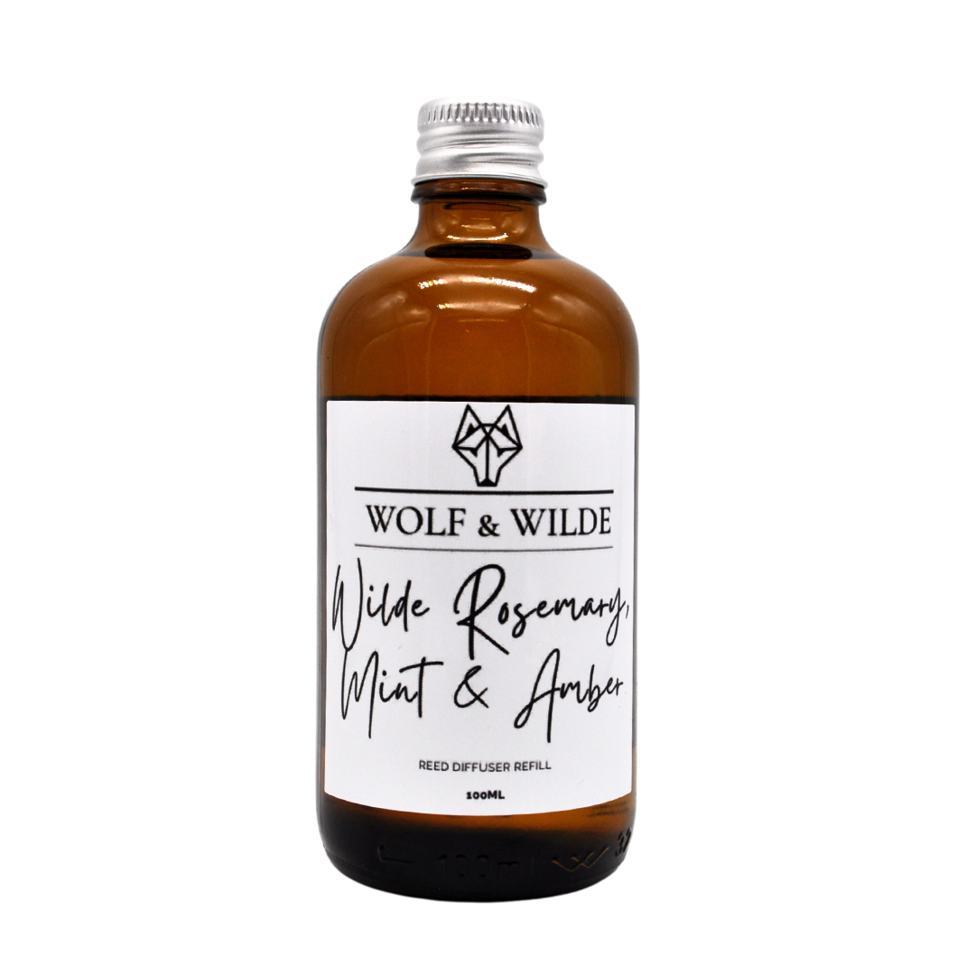 Wilde Rosemary, Mint & Amber 100ML Luxury Reed Diffuser Refill in an elegant amber glass bottle with an aluminium cap.