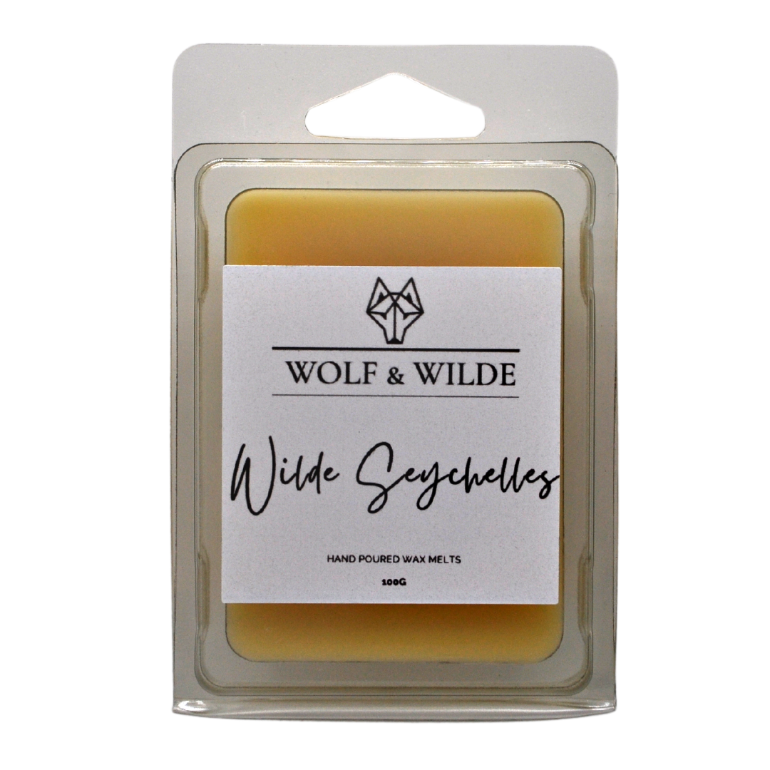 Wilde Seychelles Soy Wax Melts in a decorative package, showcasing six blocks of scented wax with tropical fragrance notes.