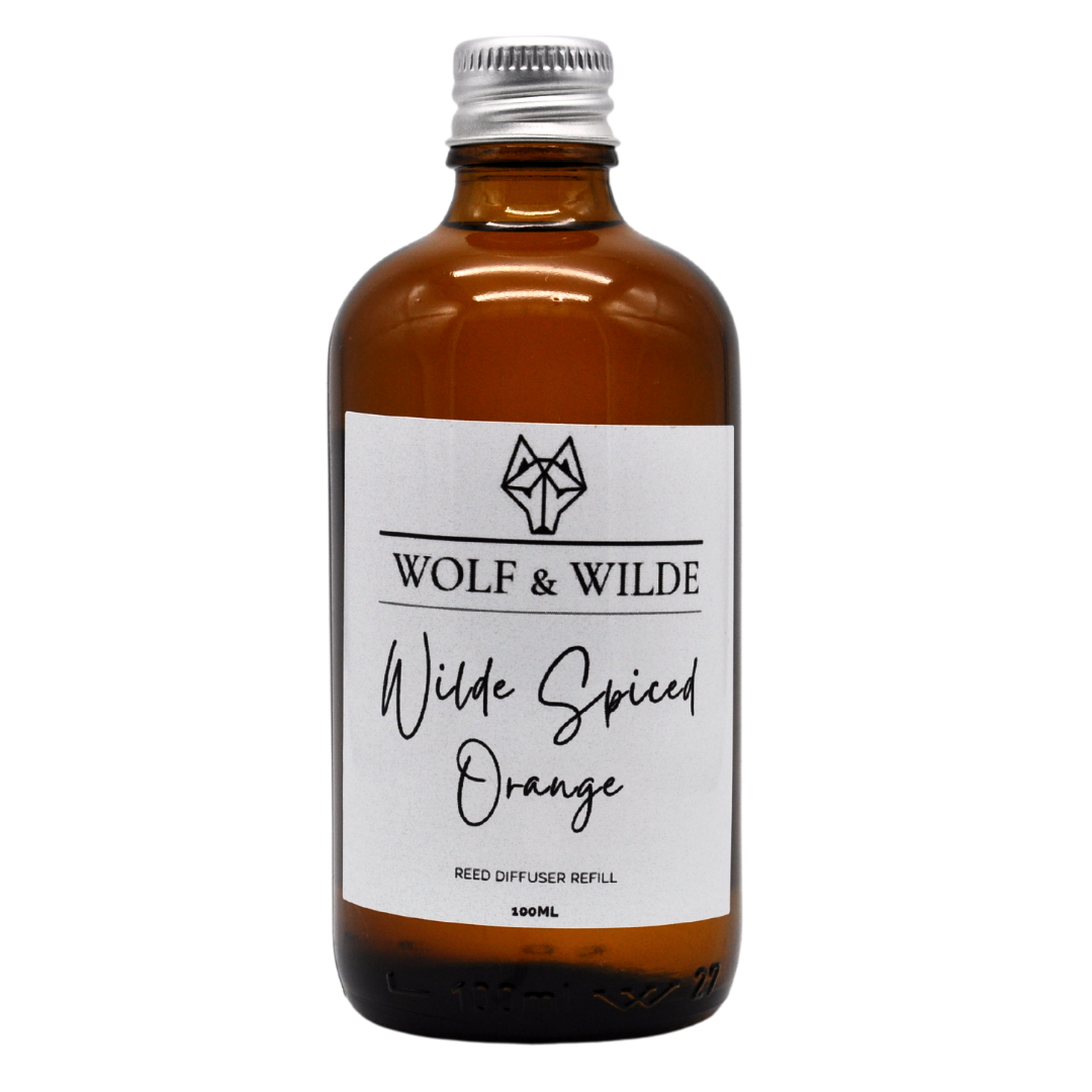 Wilde Spiced Orange 100ML Luxury Reed Diffuser Refill in elegant amber glass bottle with aluminium cap, showcasing its rich spicy fragrance.