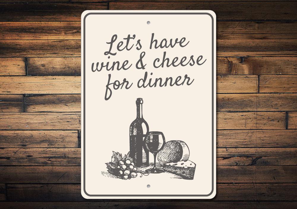 A decorative Wine & Cheese Sign made of high-quality aluminum, featuring elegant typography and a rustic design, perfect for kitchens or dining areas.