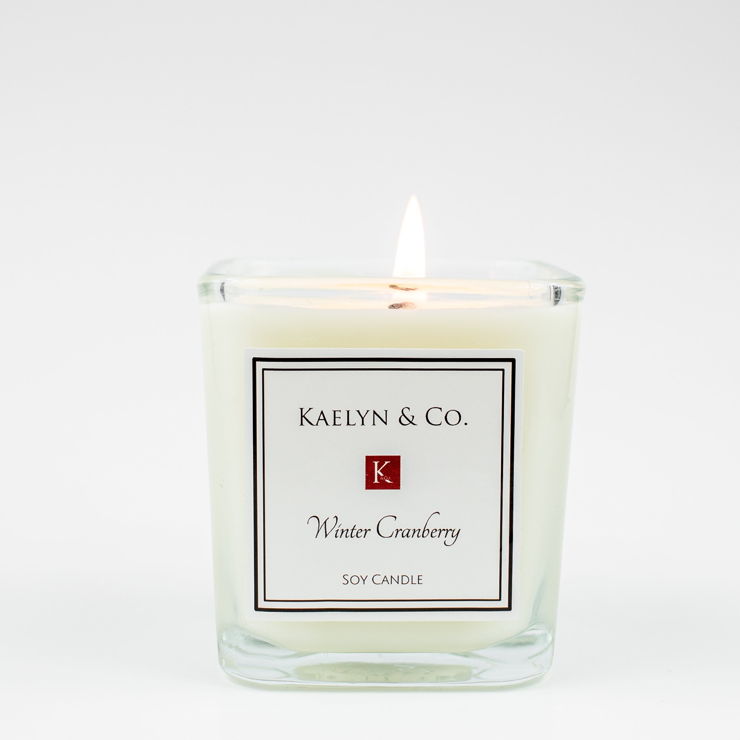 Winter Cranberry Small Cube Candle with a cozy aroma of cranberries, apples, and cinnamon, elegantly packaged in a decorative box.