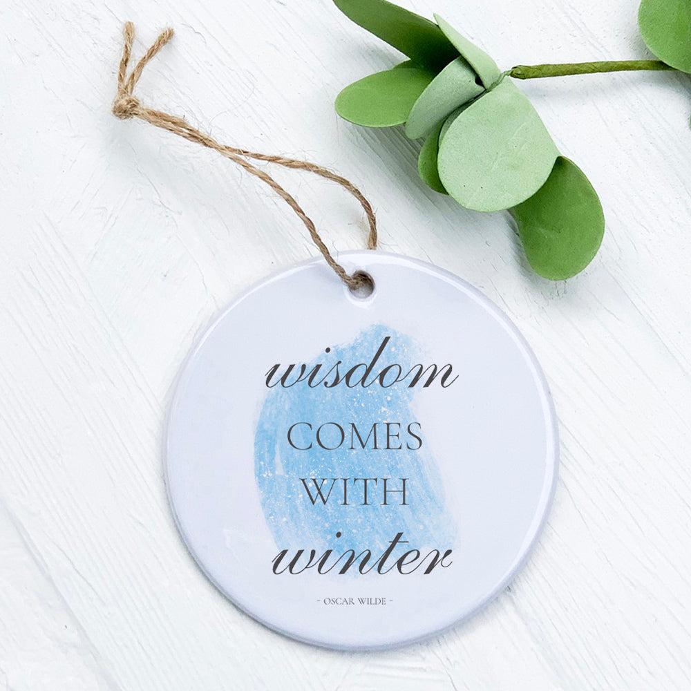 Winter Wisdom porcelain ornament featuring original designs, 2.75 inches in diameter, with a smooth gloss finish.