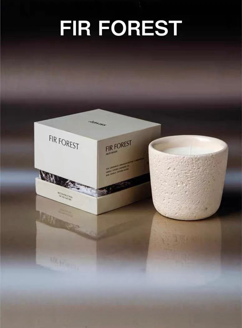 Wood Wick Soy Wax Scented Candle in a lava-like jar, featuring a refreshing snowy fir scent.