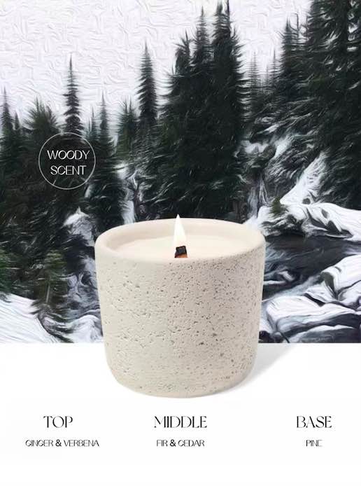 Wood Wick Soy Wax Scented Candle in a lava-like jar, featuring a refreshing snowy fir scent.