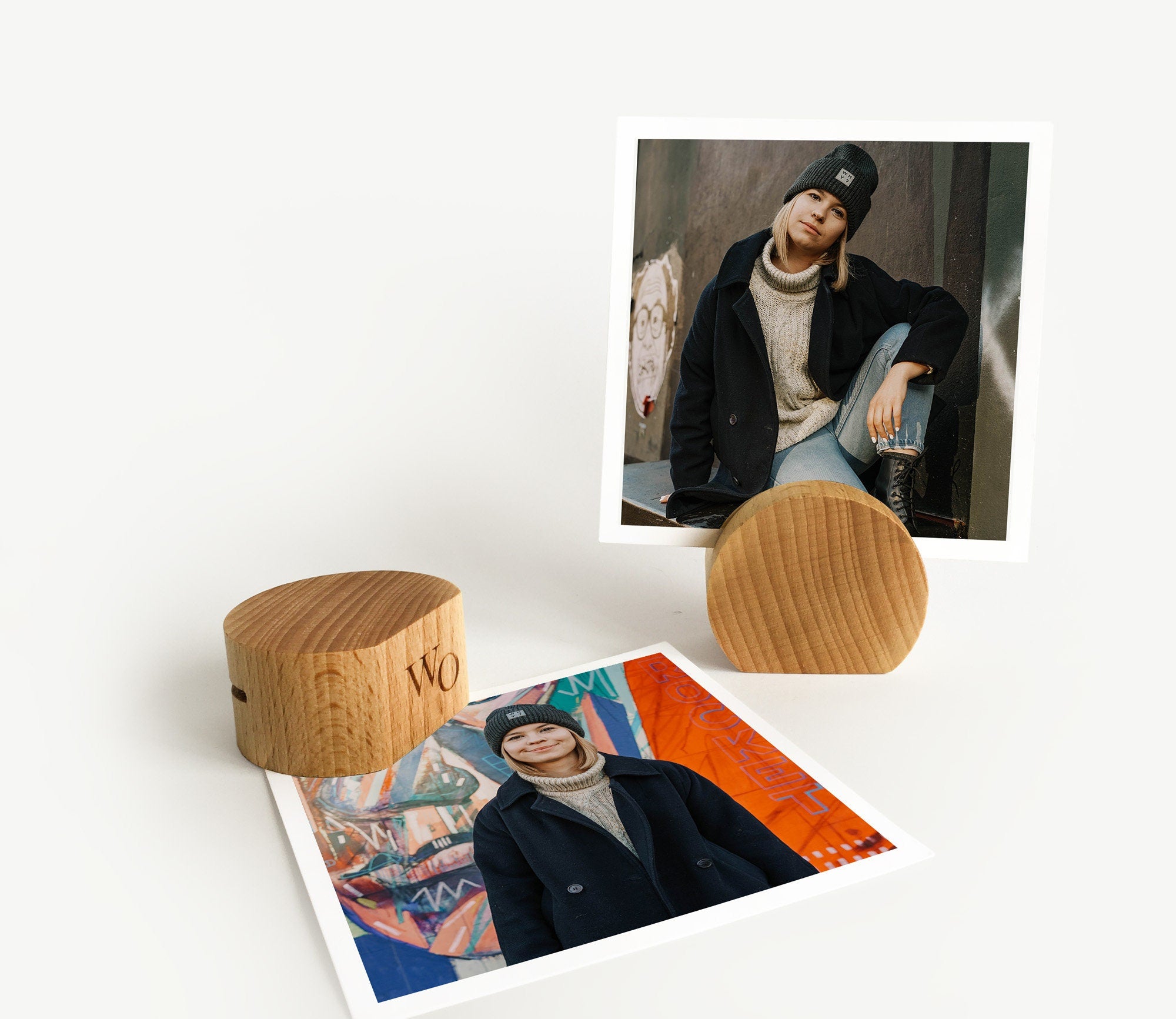 A handcrafted wooden moon card holder displaying various photos and art prints, showcasing its elegant design and eco-friendly material.