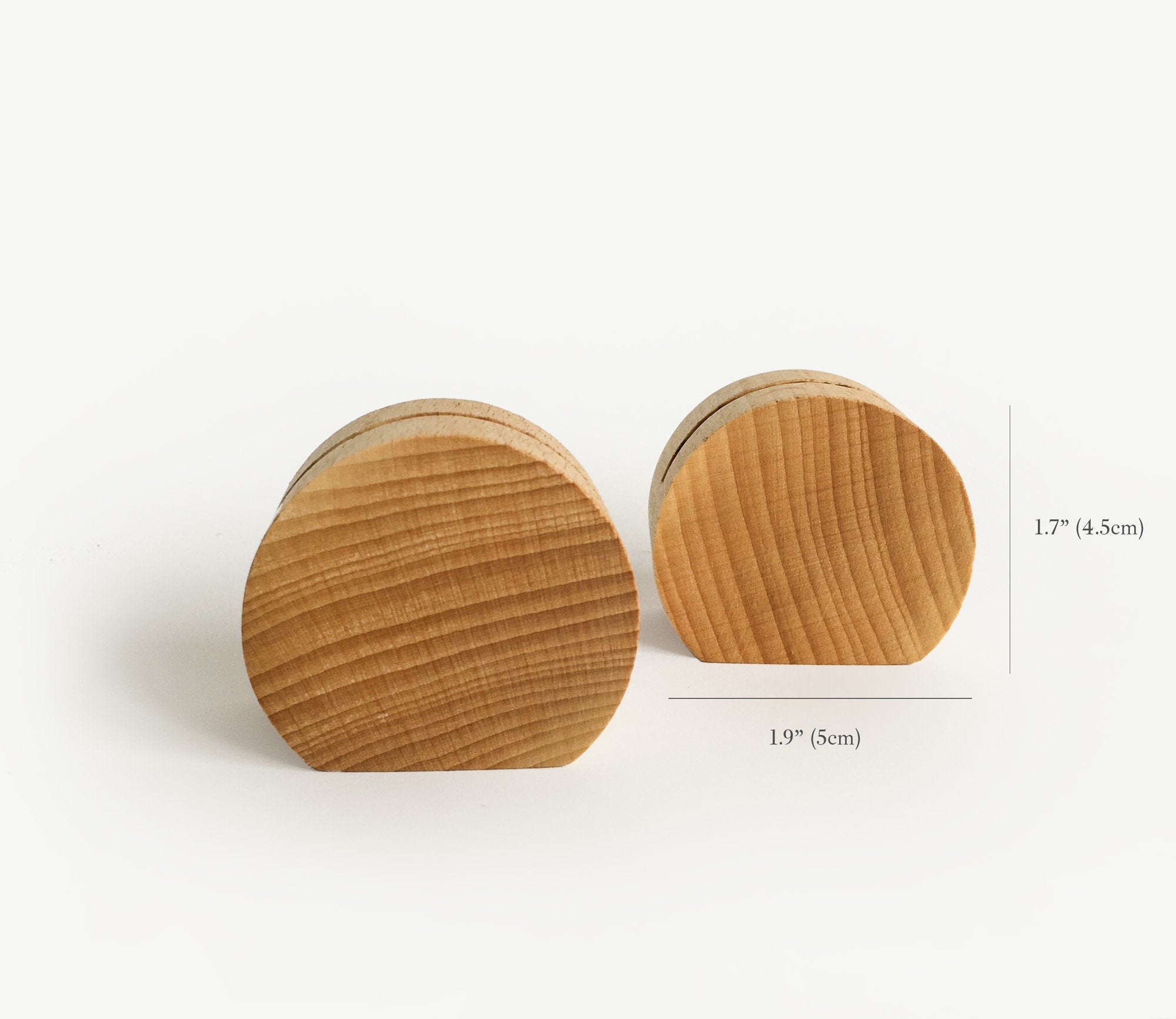 A handcrafted wooden moon card holder displaying various photos and art prints, showcasing its elegant design and eco-friendly material.