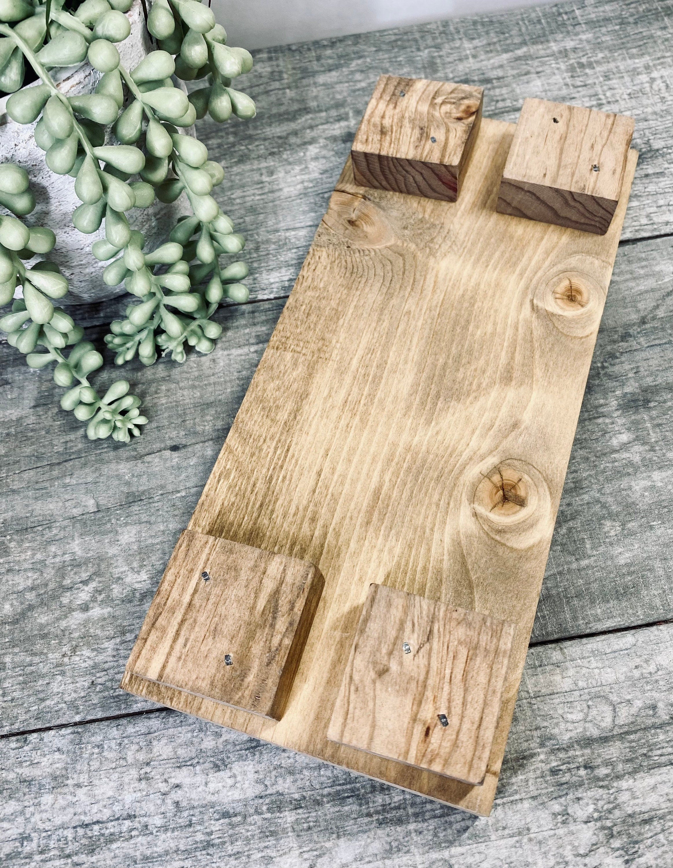 Handmade wooden riser with 'wash up buttercup' design, showcasing unique wood grain and oil-based stain, perfect for bathroom or kitchen decor.