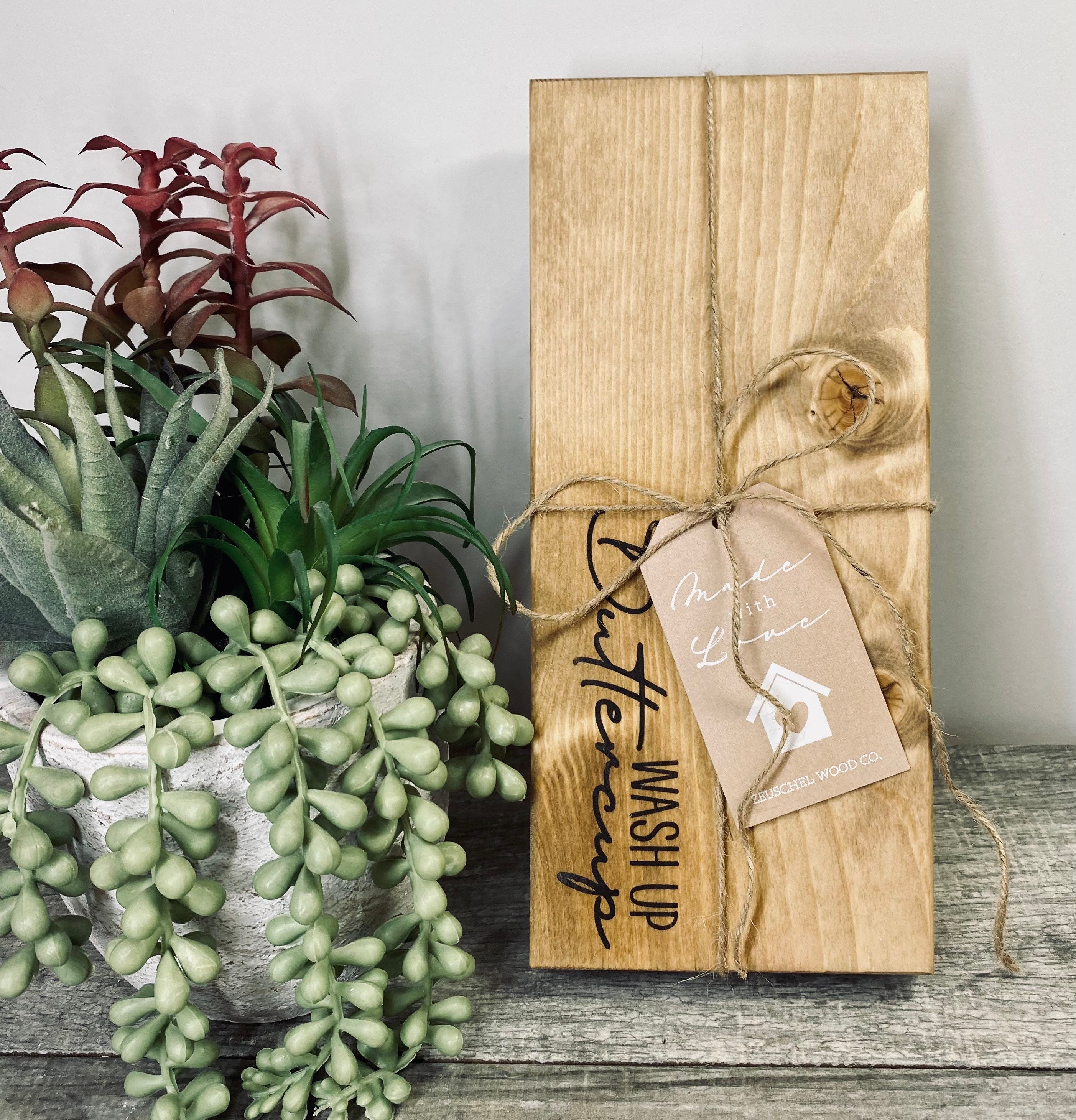 Handmade wooden riser with 'wash up buttercup' design, showcasing unique wood grain and oil-based stain, perfect for bathroom or kitchen decor.