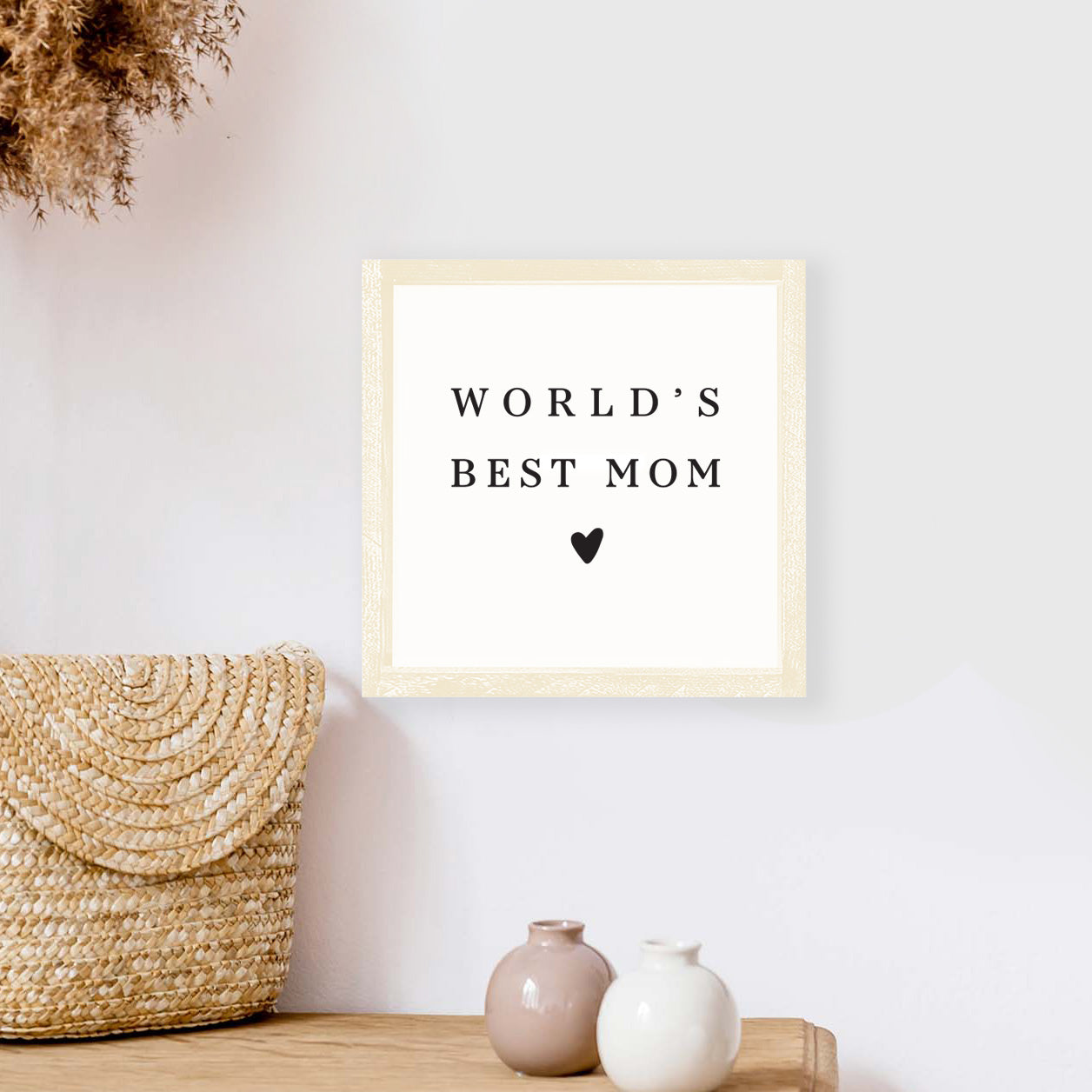 A beautifully crafted 8x8 inch wood sign that reads 'World's Best Mom', featuring a rustic pine wood frame and waterproof black text on a white background.