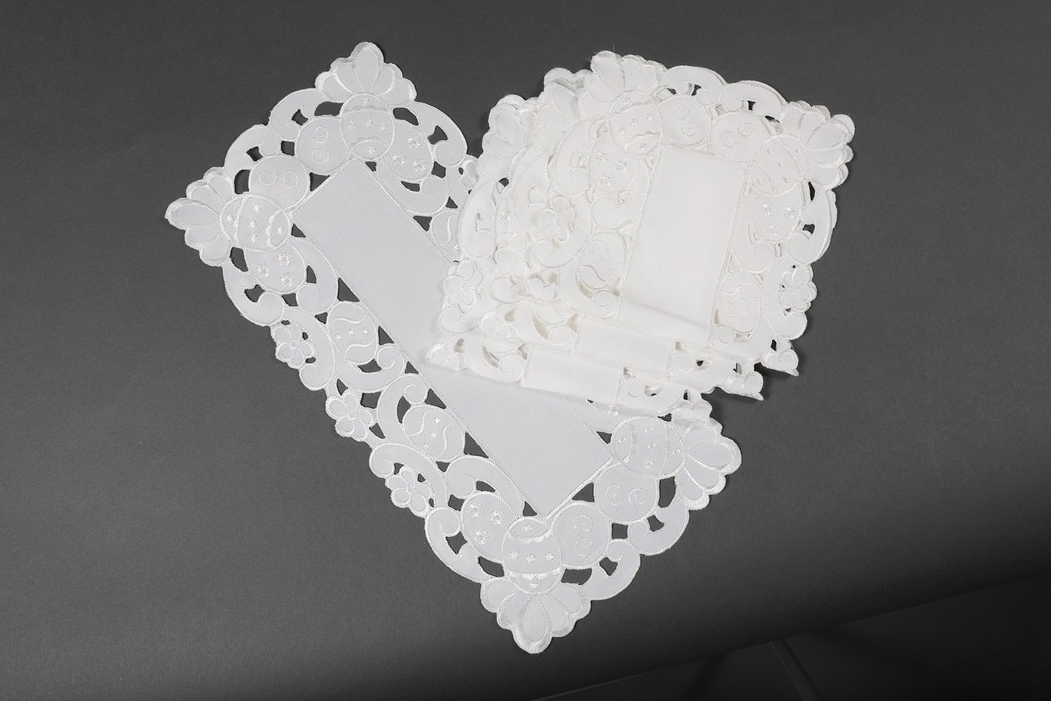 Set of 4 XD101836 Spring Egg Tray cloths featuring whimsical Easter egg embroidery and cutwork design, perfect for festive table settings.