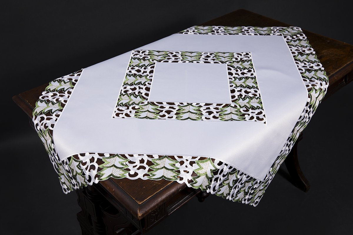 XD110708 Tannenbaum Table Topper featuring intricate Christmas tree embroidery on a crisp white background, perfect for holiday decor.