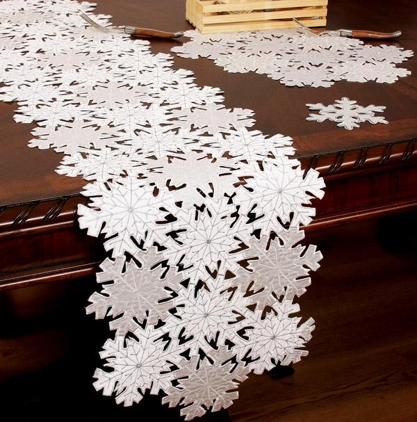 Set of 4 XD10816 Shimmer Snowflake Placemats featuring elegant snowflake cutwork design on a white background.
