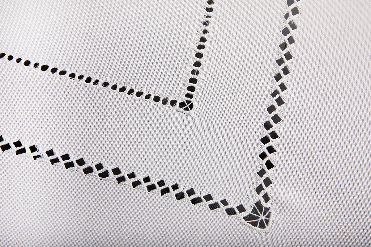 XD11099 Double Hemstitch Tablecloth in various colors with intricate cutwork trim, perfect for elegant dining settings.