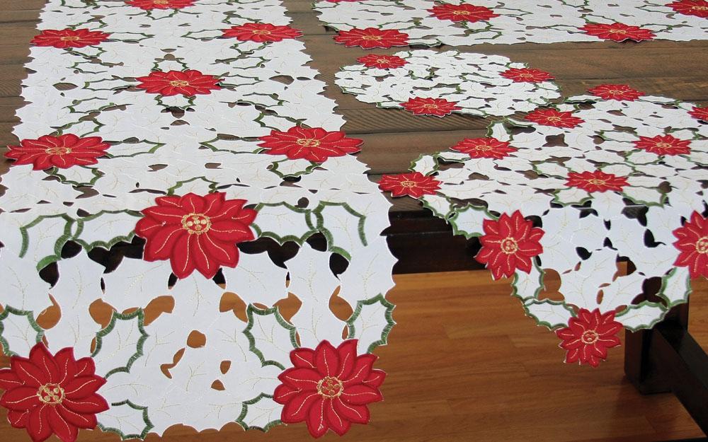 Set of 4 XD13024 Holiday Poinsettia Placemats featuring intricate embroidery and cutwork in festive colors.