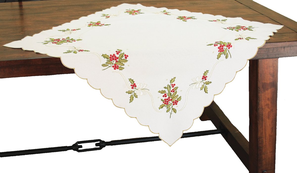 XD13401 Holly Berry Table Topper featuring elegant holly berry embroidery with gold ribbon on a white background and Christmas green trimmed edge.