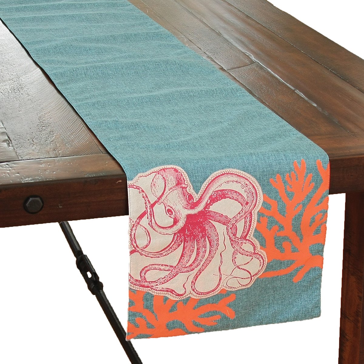 XD15138 Applique Octopus Coastal Table Runner on a table, featuring an octopus design on ocean blue faux burlap with coral accents.