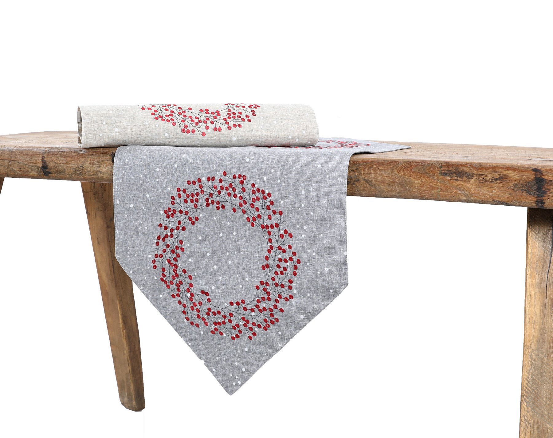 XD19821 Holly Berry Wreath embroidered table runner on a gray background with snow dots, showcasing intricate details and festive design.