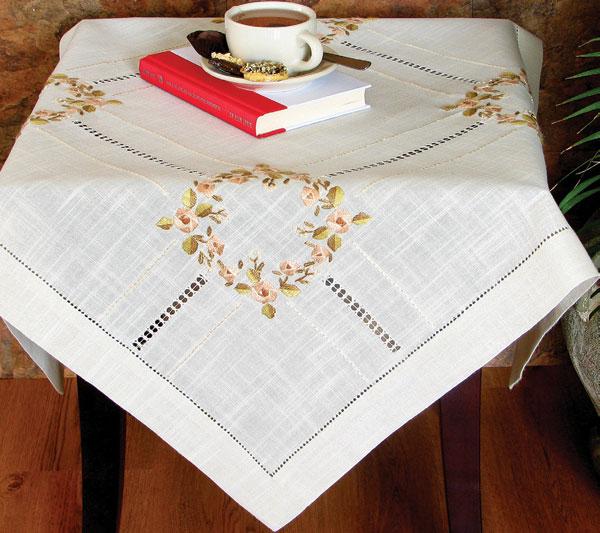 XD67801 Crewel Rose Collection featuring elegant flower embroidery and hand-rendered cutwork on table linens.