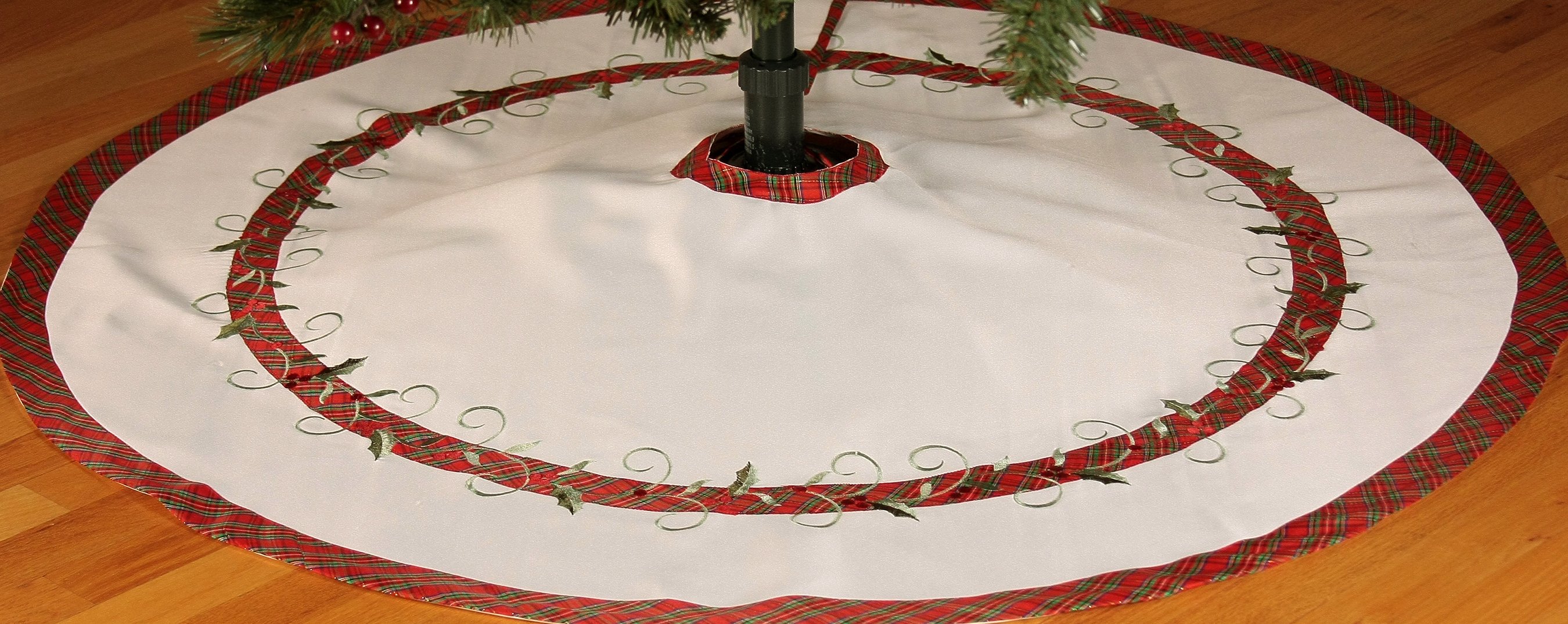 XD99904 Tartan Ribbon Tree Skirt, 48 inches round, featuring holly leaf embroidery and red/green plaid design, perfect for Christmas decor.