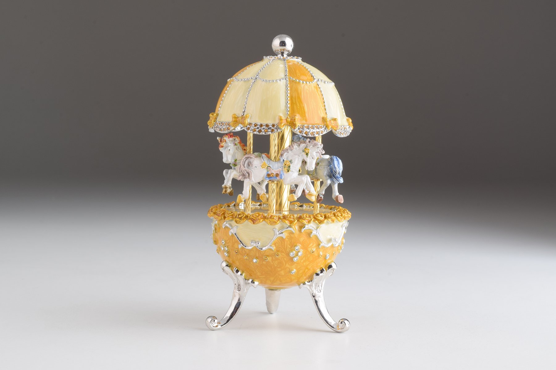 Yellow Faberge Egg Carousel Wind up Music Box with Austrian crystals and 24K Gold plating, beautifully handcrafted by Keren Kopal.