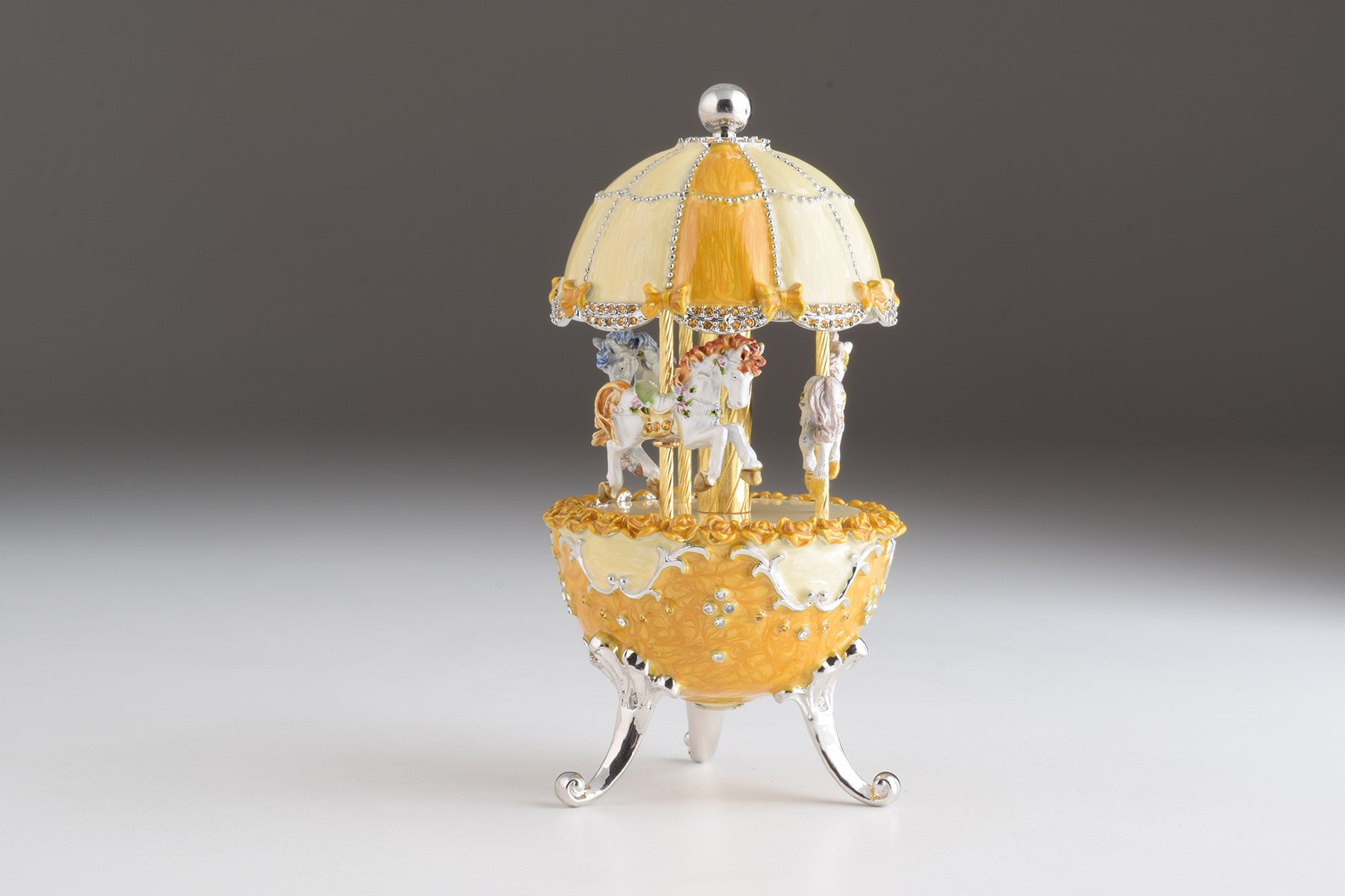 Yellow Faberge Egg Carousel Wind up Music Box with Austrian crystals and 24K Gold plating, beautifully handcrafted by Keren Kopal.